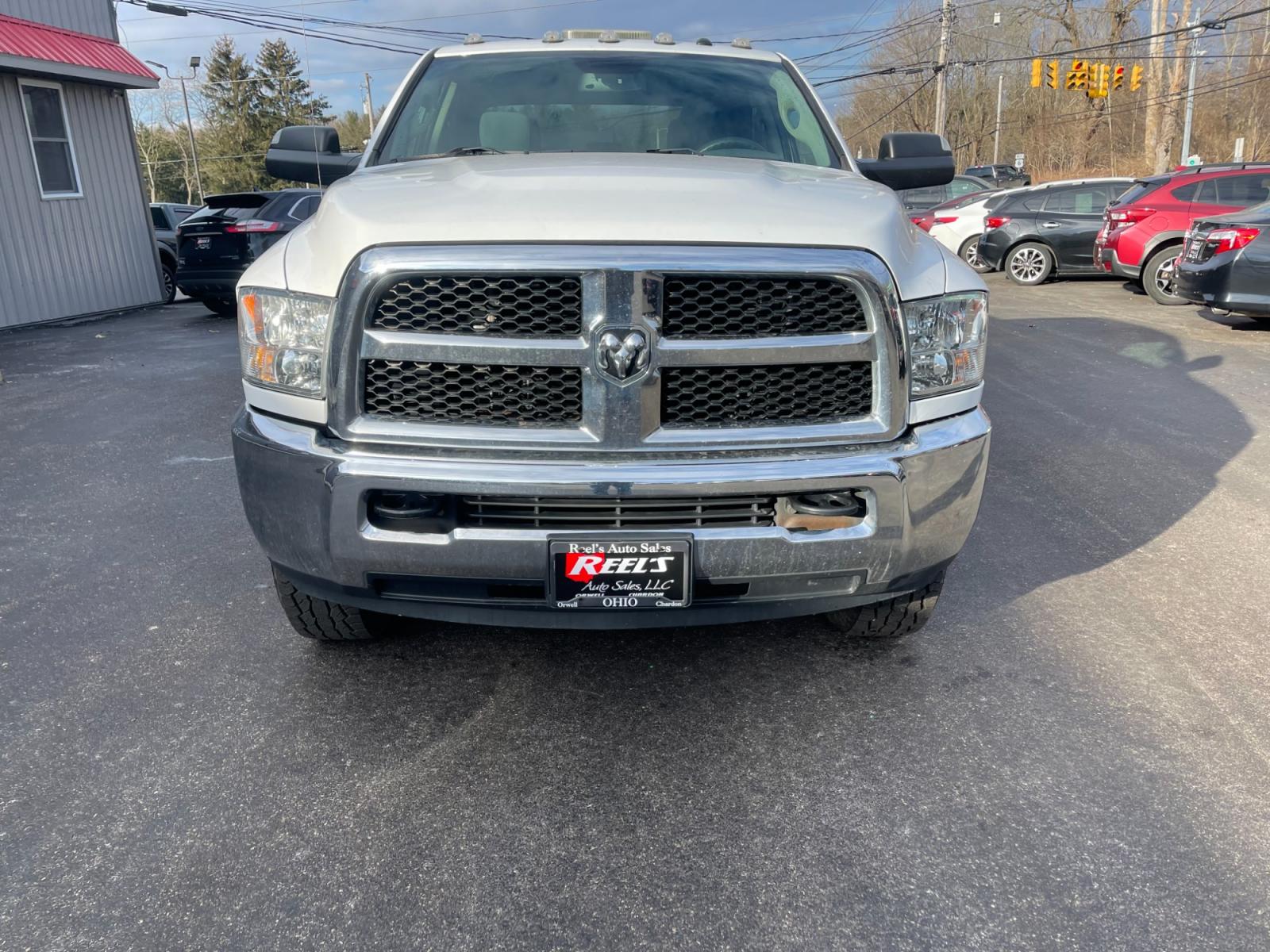 2018 White /Black RAM 3500 Tradesman Crew Cab 4WD (3C63R3GJ7JG) with an 6.4L V8 OHV 16V engine, 6A transmission, located at 11115 Chardon Rd. , Chardon, OH, 44024, (440) 214-9705, 41.580246, -81.241943 - This 2018 Ram 3500 Tradesman Crew Cab with a Long Bed, equipped with the robust 6.4L V8 HEMI engine paired with a 6-speed automatic transmission, offers significant hauling capabilities, featuring a towing capacity of up to 12,440 pounds and a payload capacity of 4,373 pounds. This model is well-sui - Photo #1